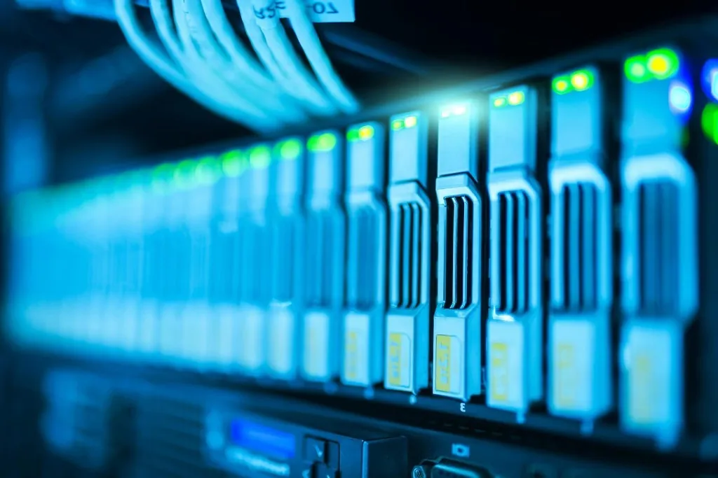 Rows of server racks lit with blue status lights